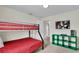 Bedroom with bunk bed and green storage unit at 3097 Pequod Pl, Kissimmee, FL 34746