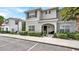 Two-story house with gray siding, brown accents, and landscaping at 3097 Pequod Pl, Kissimmee, FL 34746
