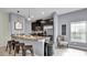 Modern kitchen with granite counters, stainless steel appliances, and breakfast bar at 3097 Pequod Pl, Kissimmee, FL 34746