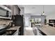 Kitchen boasts granite countertops, stainless steel appliances, and an eat-in island at 3097 Pequod Pl, Kissimmee, FL 34746