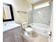 Updated bathroom with marble shower and vanity at 333 E Church St, Deland, FL 32724