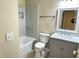 Updated bathroom with marble-tiled shower and gray vanity at 333 E Church St, Deland, FL 32724