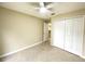 Bright bedroom with ceiling fan and double door closet at 333 E Church St, Deland, FL 32724