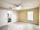 Bedroom with private bathroom access and ceiling fan at 333 E Church St, Deland, FL 32724