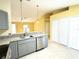 Modern kitchen with gray cabinets and granite countertops at 333 E Church St, Deland, FL 32724