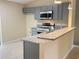 Modern kitchen with gray cabinets and granite countertops at 333 E Church St, Deland, FL 32724