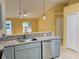 Modern kitchen with gray cabinets and granite countertops at 333 E Church St, Deland, FL 32724