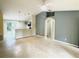 Open living room with high ceilings and a view into the kitchen at 333 E Church St, Deland, FL 32724