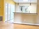 Open living room with high ceilings and a view into the kitchen at 333 E Church St, Deland, FL 32724