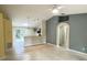 Open living room with high ceilings and a view into the kitchen at 333 E Church St, Deland, FL 32724