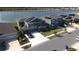 Aerial view of a two-story house with solar panels and a lake in the background at 4390 Bull St, St Cloud, FL 34772
