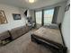 Well-lit bedroom with a workspace and double bed at 4390 Bull St, St Cloud, FL 34772