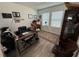 Home office with a large desk, comfortable chair, and ample natural light at 4390 Bull St, St Cloud, FL 34772