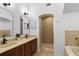 Bathroom with double vanity, shower, and bathtub at 4713 Anson Ln, Orlando, FL 32814