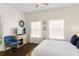 Bedroom with a queen bed and dark wood floors at 4713 Anson Ln, Orlando, FL 32814