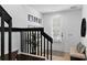 Modern entryway featuring a bench, plant, and staircase at 4713 Anson Ln, Orlando, FL 32814