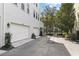 Attached garage with white doors and private driveway at 4713 Anson Ln, Orlando, FL 32814