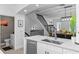 Modern kitchen with island, stainless steel appliances, and powder room at 4713 Anson Ln, Orlando, FL 32814