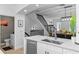 Modern kitchen with white cabinets, stainless steel appliances, and an island at 4713 Anson Ln, Orlando, FL 32814