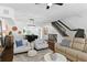 Open living space with hardwood floors, comfortable seating, and natural light at 4713 Anson Ln, Orlando, FL 32814