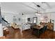 Open living and dining area with hardwood floors and modern furniture at 4713 Anson Ln, Orlando, FL 32814