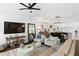 Spacious living room with neutral tones, hardwood floors and comfortable seating at 4713 Anson Ln, Orlando, FL 32814