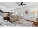 Spacious living room with a comfortable seating arrangement and large windows at 4713 Anson Ln, Orlando, FL 32814