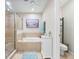 Bright bathroom with glass shower, soaking tub, white vanity, and tile flooring at 5381 Via Appia Way, Sanford, FL 32771