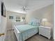 Cozy bedroom with a ceiling fan, and a white bed set at 5381 Via Appia Way, Sanford, FL 32771