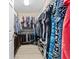 Walk-in closet with ample hanging space, shelving, and organized storage solutions at 5381 Via Appia Way, Sanford, FL 32771