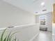 Bright hallway with white walls and a window at 5381 Via Appia Way, Sanford, FL 32771