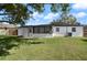 Backyard with a well-maintained lawn perfect for outdoor activities and relaxation at 608 S Oxalis Ave, Orlando, FL 32807