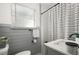 Charming bathroom featuring gray accents, and a decorative shower curtain at 608 S Oxalis Ave, Orlando, FL 32807