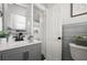 Bathroom with a gray vanity and tiled walls at 608 S Oxalis Ave, Orlando, FL 32807