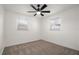 Bedroom with neutral carpeting and a modern ceiling fan at 608 S Oxalis Ave, Orlando, FL 32807
