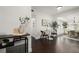 Home interior with a dining table and decor visible from the living area with neutral decor at 608 S Oxalis Ave, Orlando, FL 32807