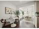 Stylish dining room with modern decor, hardwood floors, modern art, and an open concept layout at 608 S Oxalis Ave, Orlando, FL 32807