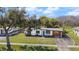 Charming home featuring a well-manicured front lawn and inviting curb appeal at 608 S Oxalis Ave, Orlando, FL 32807