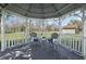 Interior view of the gazebo with outdoor furniture on a sunny day at 608 S Oxalis Ave, Orlando, FL 32807