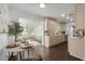 Open-concept kitchen and dining area with hardwood floors and featuring stainless steel appliances at 608 S Oxalis Ave, Orlando, FL 32807