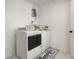Well-lit laundry room with white marble-style flooring, in-unit washer and dryer at 608 S Oxalis Ave, Orlando, FL 32807