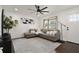Comfortable living room with modern decor, a large window, recessed lighting, and ceiling fan at 608 S Oxalis Ave, Orlando, FL 32807