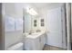 Clean bathroom with a double vanity, modern fixtures, and well-lit with great accents at 7600 Mackinaw Ln, Kissimmee, FL 34747