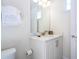 Bathroom featuring a white vanity and sink with a toilet at 7600 Mackinaw Ln, Kissimmee, FL 34747