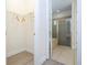 Bathroom featuring walk-in closet, walk-in shower and soaker tub at 7600 Mackinaw Ln, Kissimmee, FL 34747
