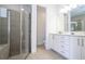 Bright bathroom featuring a walk-in shower, bath and double vanity at 7600 Mackinaw Ln, Kissimmee, FL 34747