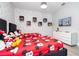 Delightful ' bedroom featuring twin beds with fun Mickey Mouse bedding, wall decorations, and a TV at 7600 Mackinaw Ln, Kissimmee, FL 34747