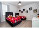Whimsical ' bedroom with two twin beds, playful Mickey Mouse decor, and modern lighting at 7600 Mackinaw Ln, Kissimmee, FL 34747