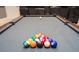 The game room has a pool table with billiard balls staged at 7600 Mackinaw Ln, Kissimmee, FL 34747