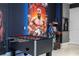 Game room features foosball table and arcade game at 7600 Mackinaw Ln, Kissimmee, FL 34747